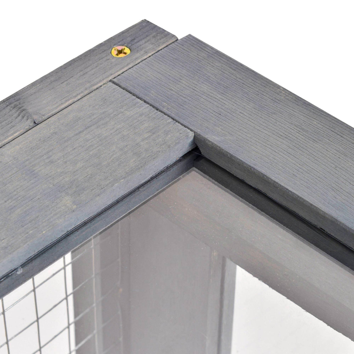 Grey wooden enclosure top corner with ventilated wire mesh panel and trim