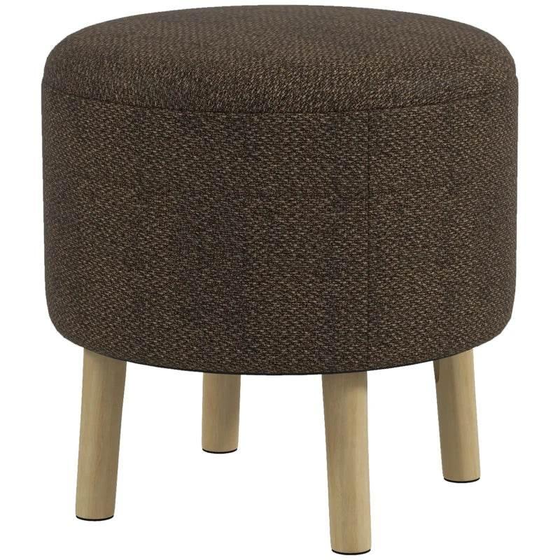 Round brown upholstered ottoman stool with padded top and light wood legs