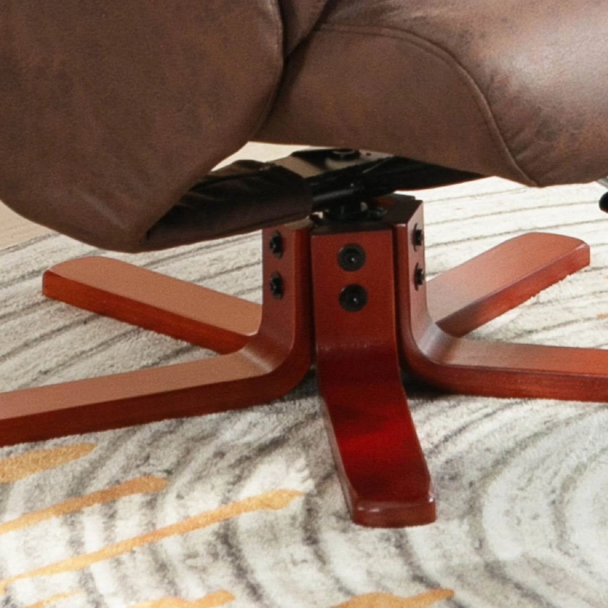 Recliner chair base close-up with dark brown padding and red wood legs