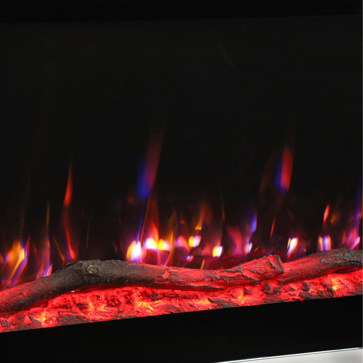 Close-up of electric fireplace flame effect with glowing red embers behind glass.