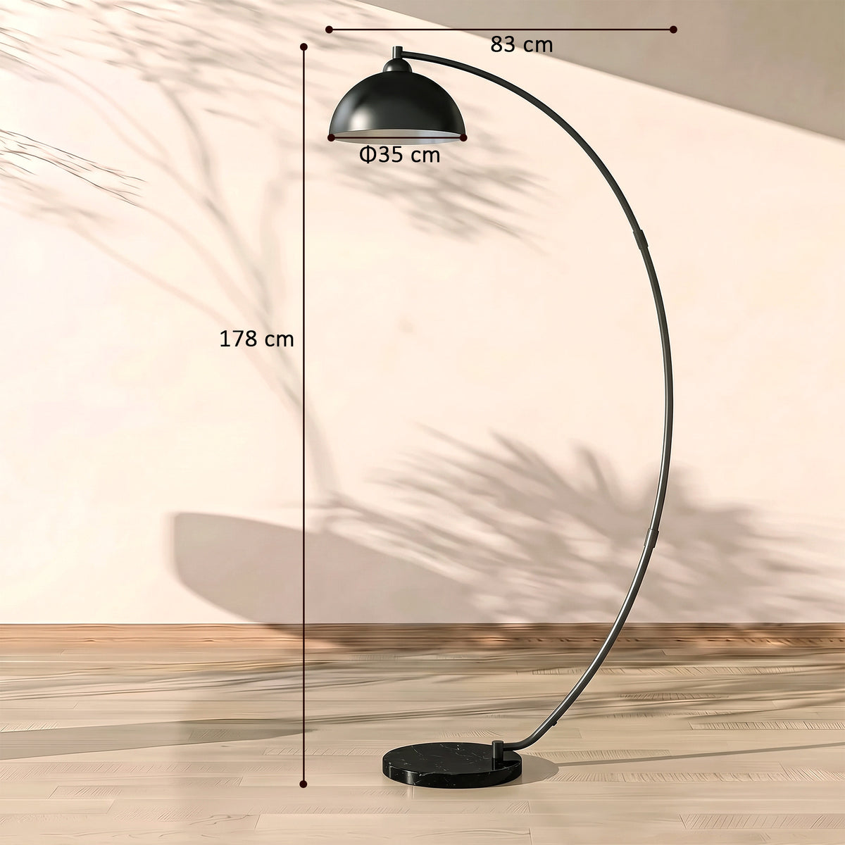 Black arc floor lamp with curved frame, bowl shade, and round base (size guide)