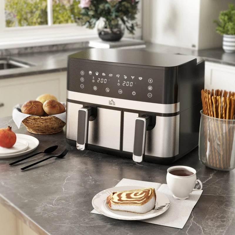 Stainless dual-basket air fryer with digital panel and two front drawers, cooking food
