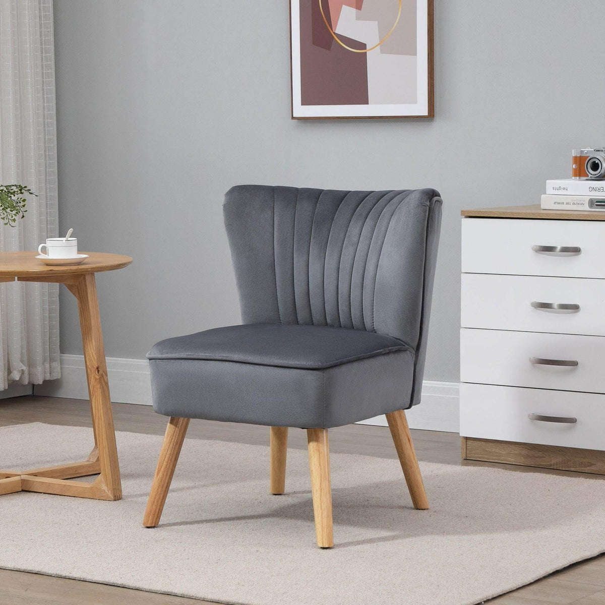 Grey velvet accent tub chair with channel-tufted back and cushioned seat