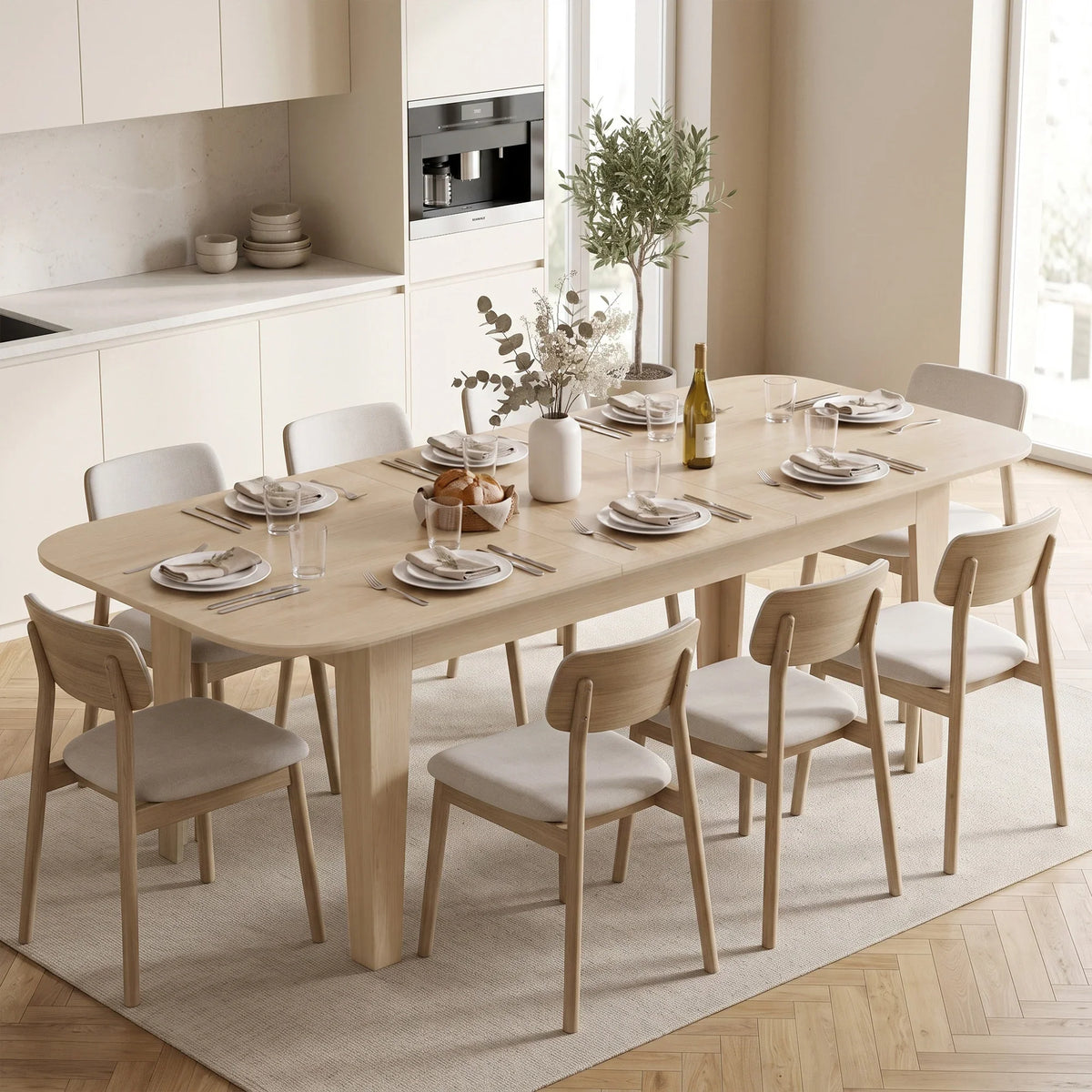 Light oak extendable oval dining table with chairs and set dinner plates