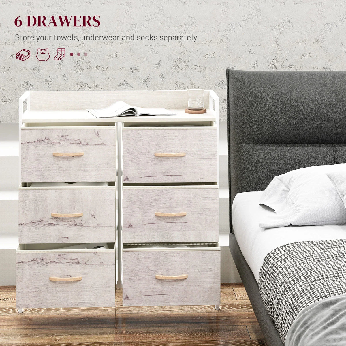 White six-drawer storage chest with light wood pulls, front view beside a bed
