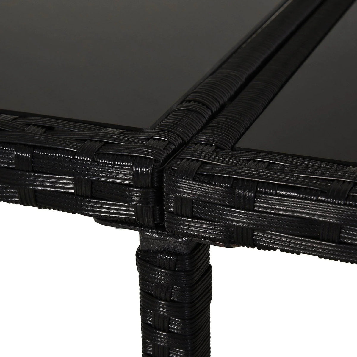 Close-up of black woven rattan patio table frame corner and edge weave