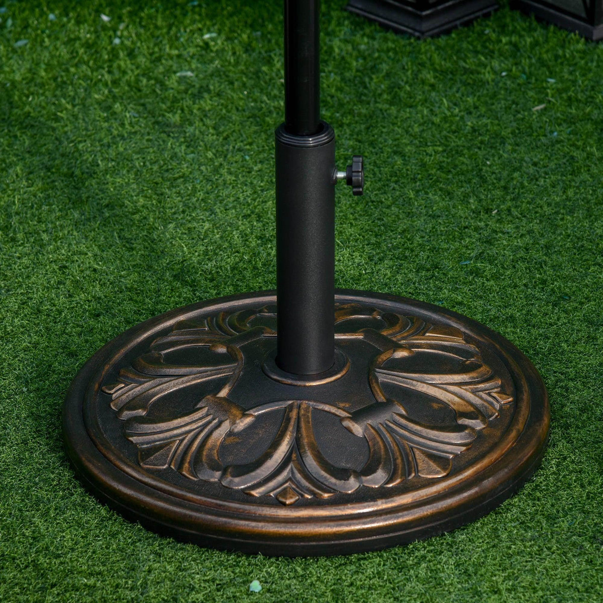 Bronze round umbrella base weight with carved floral pattern and central pole holder