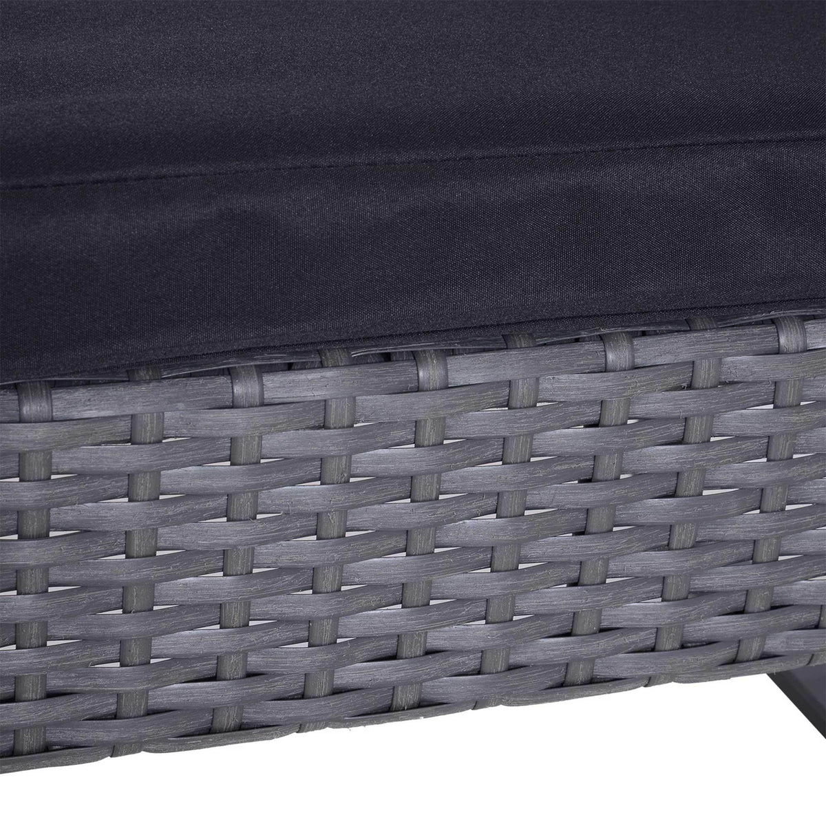 Close-up of grey rattan woven texture with dark cushion edge
