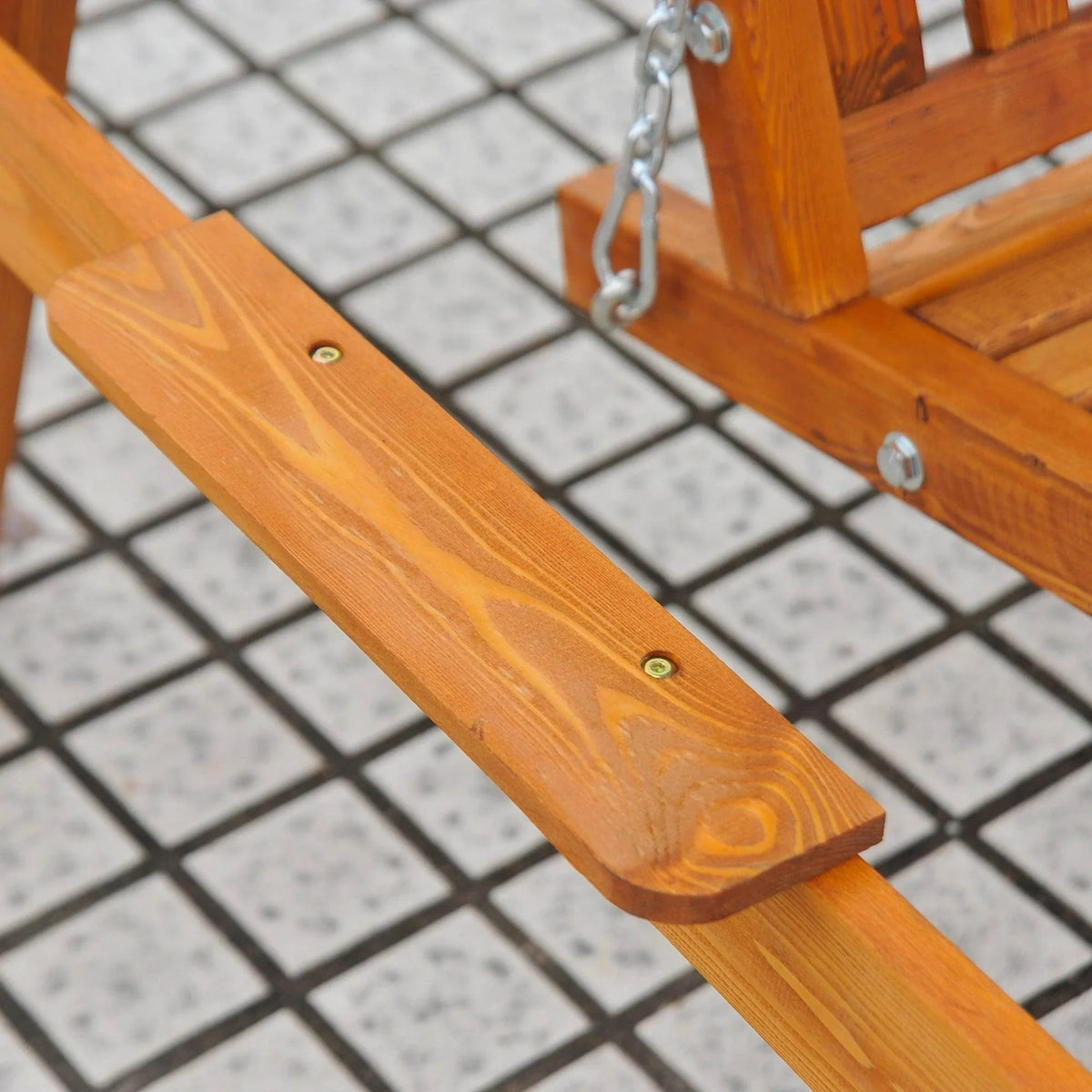 Sturdy wooden garden swing with metal chain, perfect for outdoor relaxation on tiled patio.
