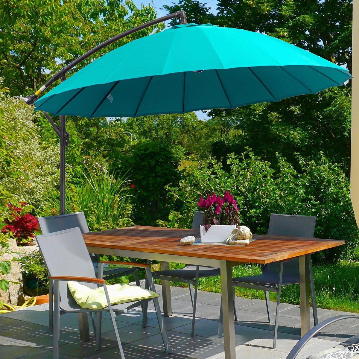 Turquoise cantilever patio umbrella with arched canopy and black support frame