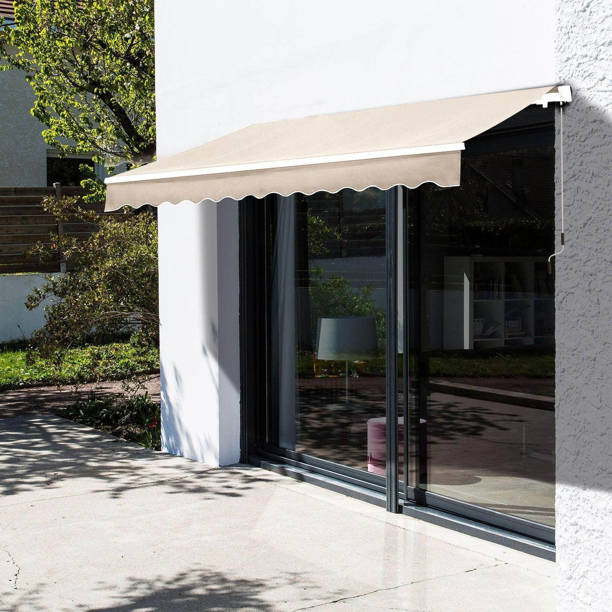 Beige retractable awning over patio doors, providing shade for outdoor living space