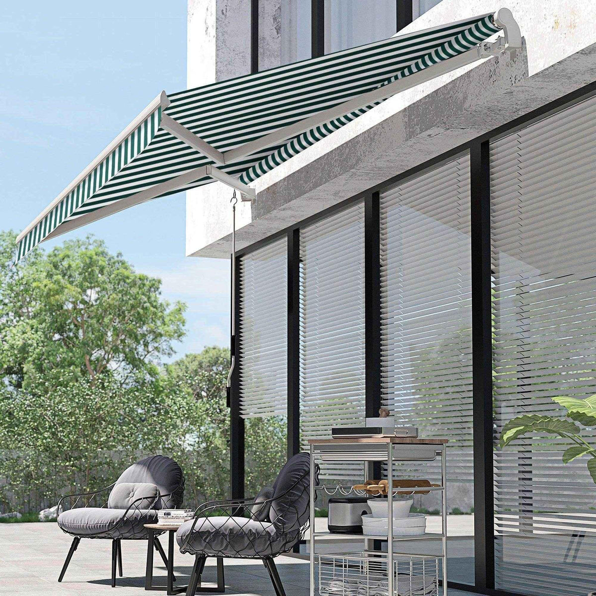 Green and white striped patio awning shading outdoor seating area with modern furniture