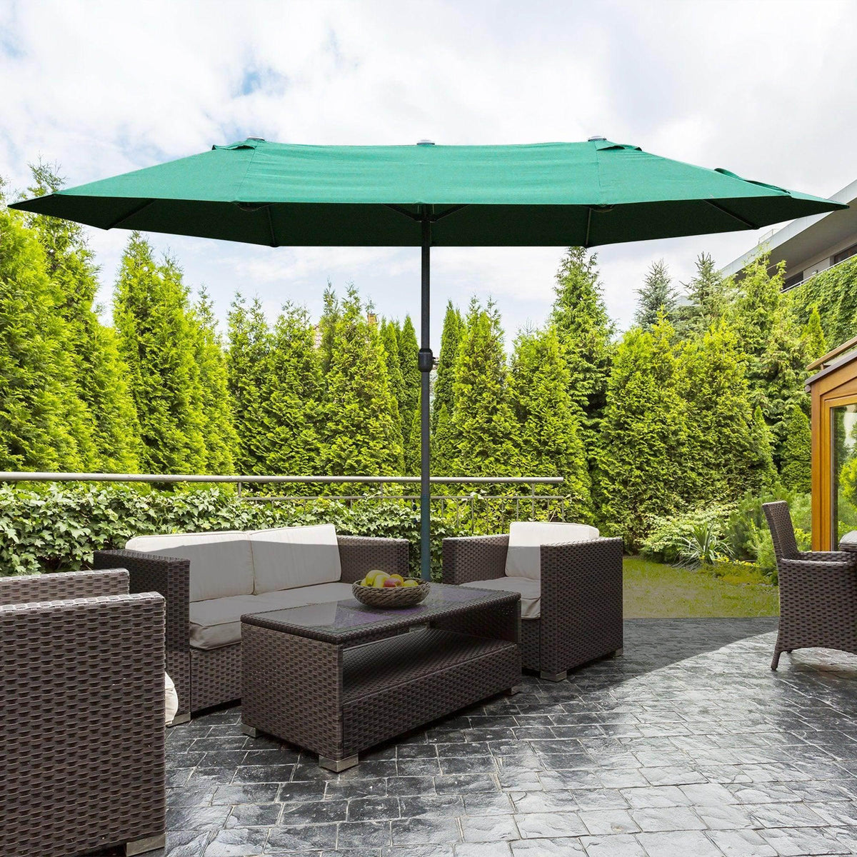 4.6 m patio sun umbrella with green canopy above outdoor seating