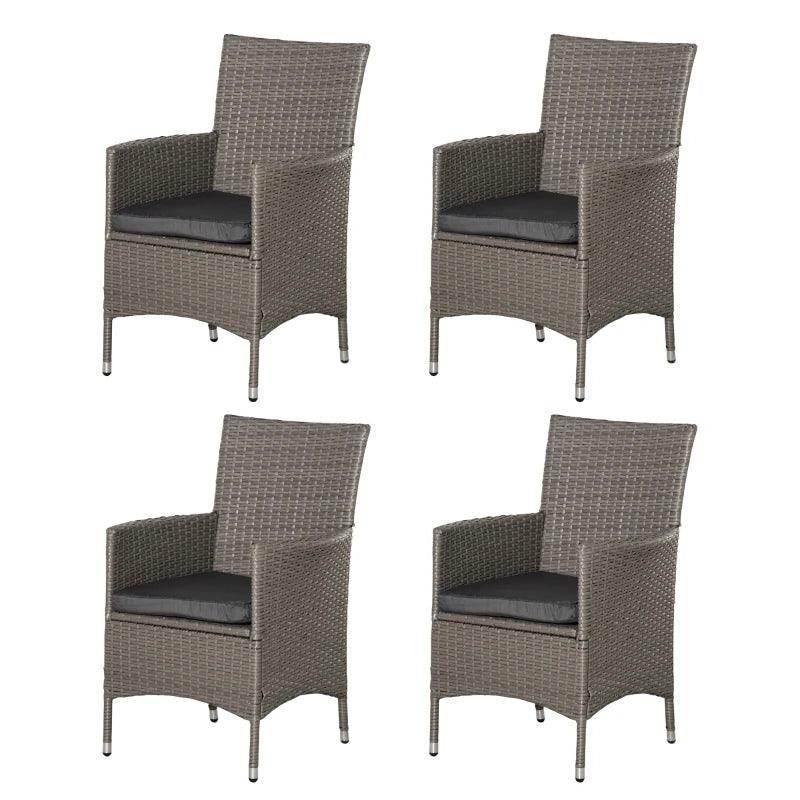 Set of four gray-brown rattan armchairs with dark seat cushions and raised armrests