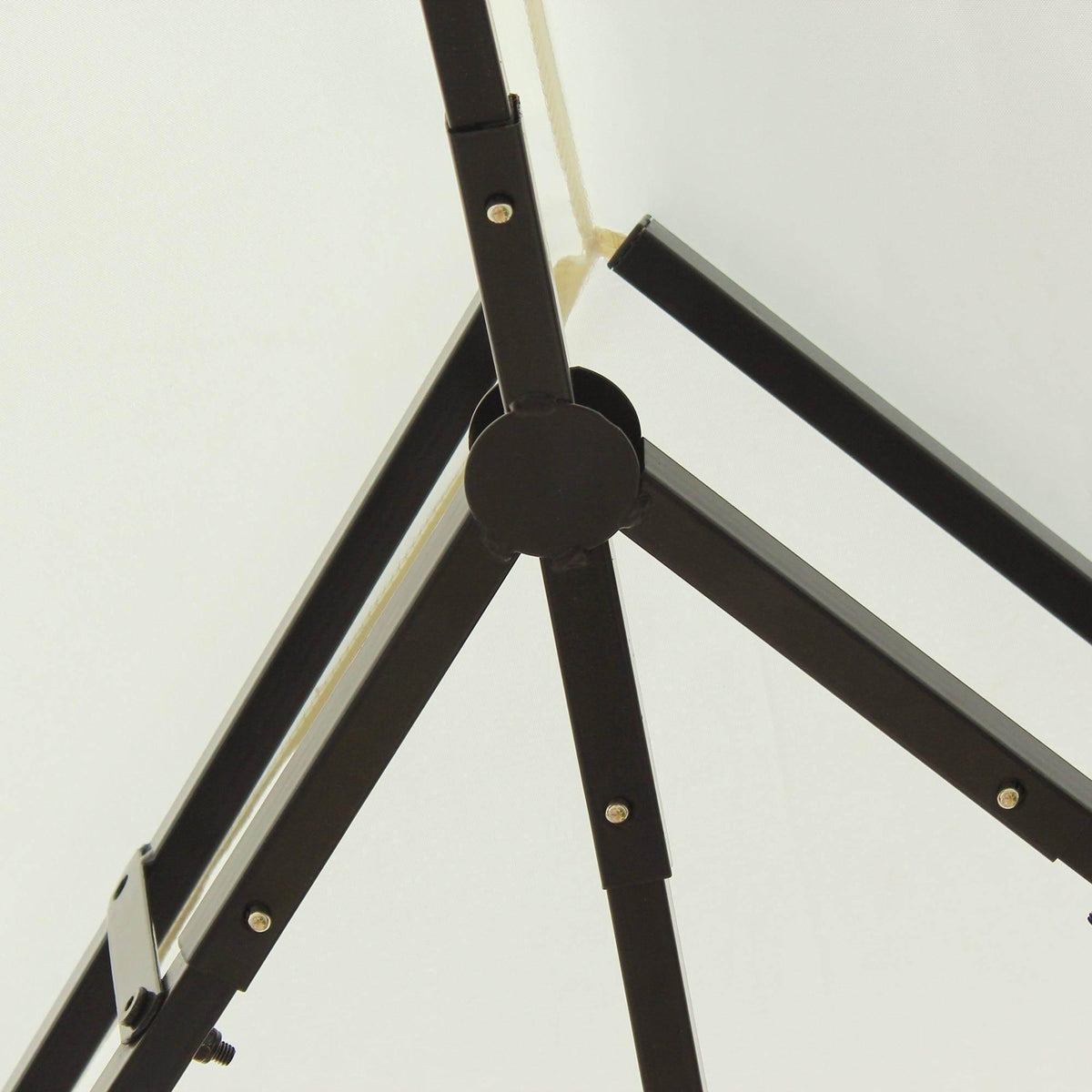 Black metal frame joint with bolts, part of a garden gazebo or patio canopy structure