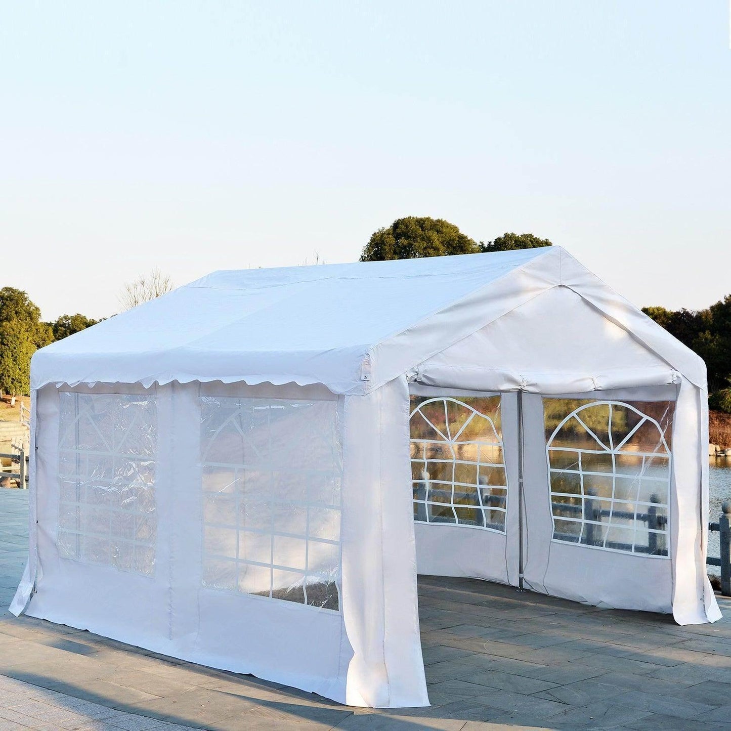 White 4x4m outdoor gazebo with steel frame and clear window panels on paved surface near trees