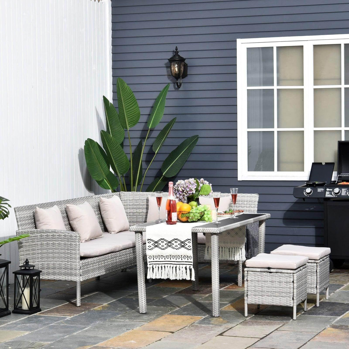 Outsunny 6-seater rattan corner dining set with gray sofa, glass table, and two stools