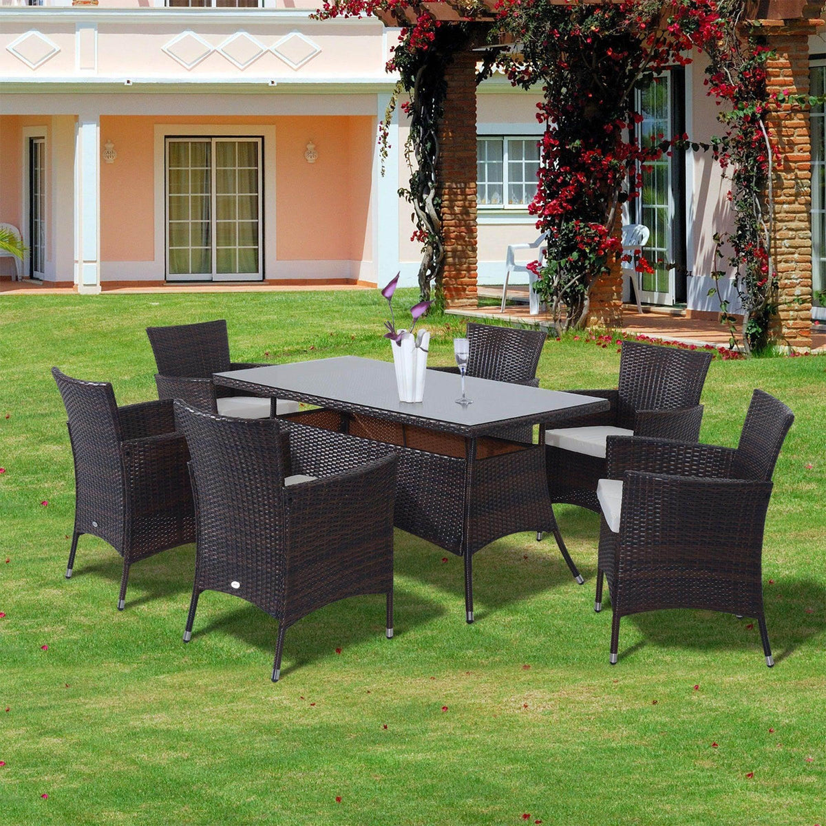 Brown wicker outdoor dining set with 6 chairs on lawn, perfect for garden patios and backyard entertaining.