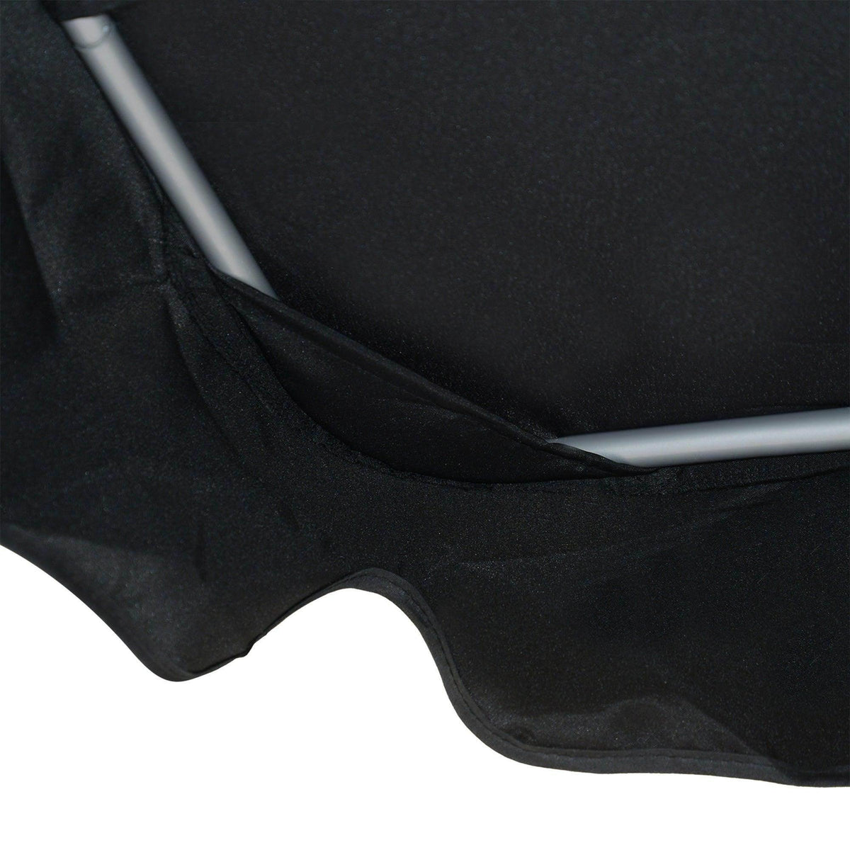Close-up of black sling fabric seat with curved frame edge on porch swing