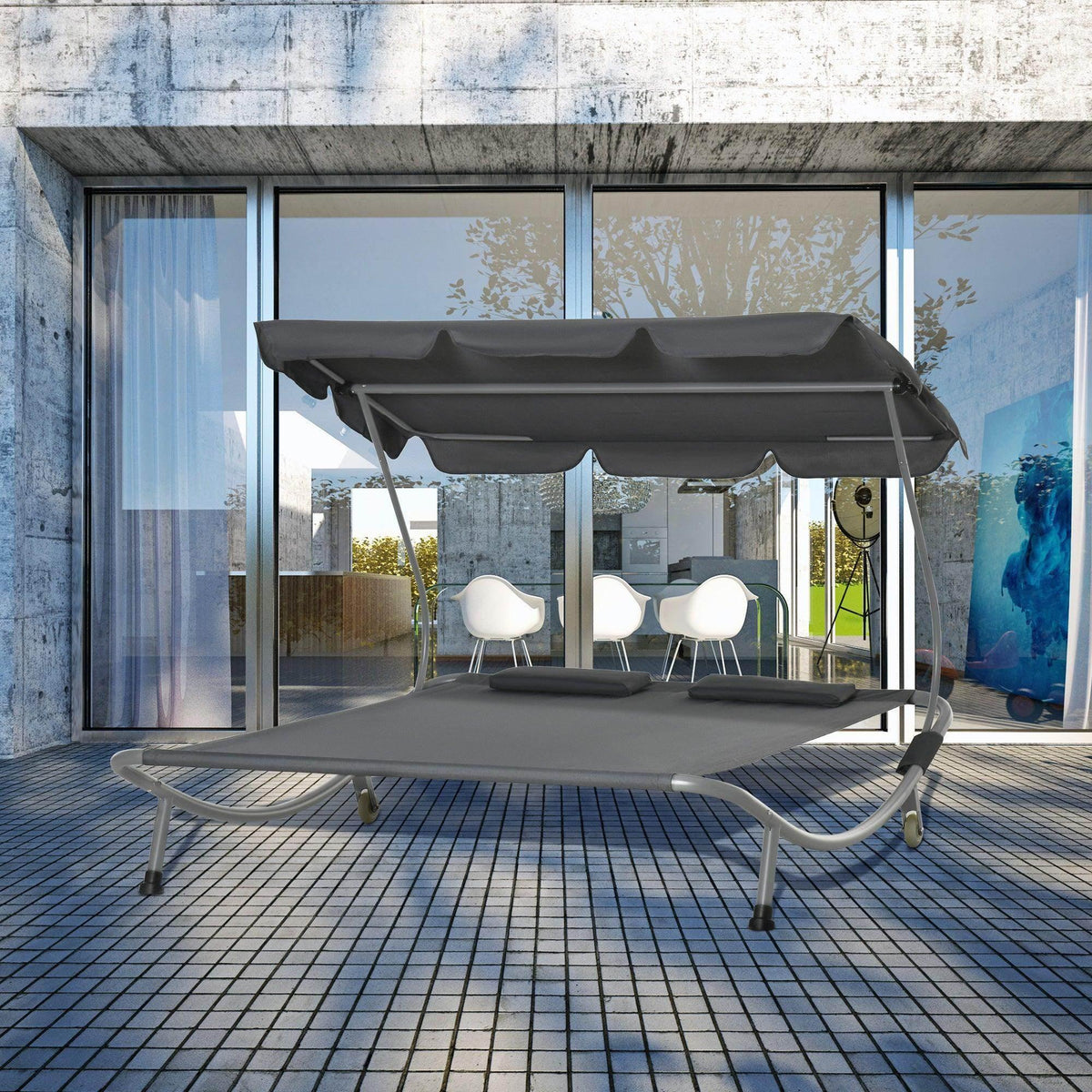 Grey double hammock daybed lounger with canopy, curved metal frame and fabric seat
