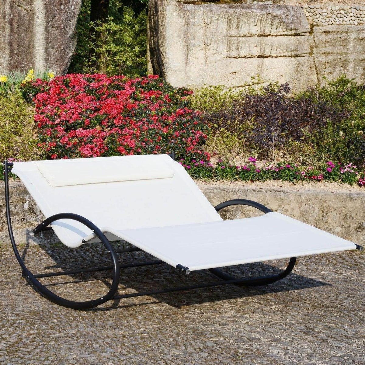 Beige double sun lounger with pillow, black rocking steel frame and curved arm rests