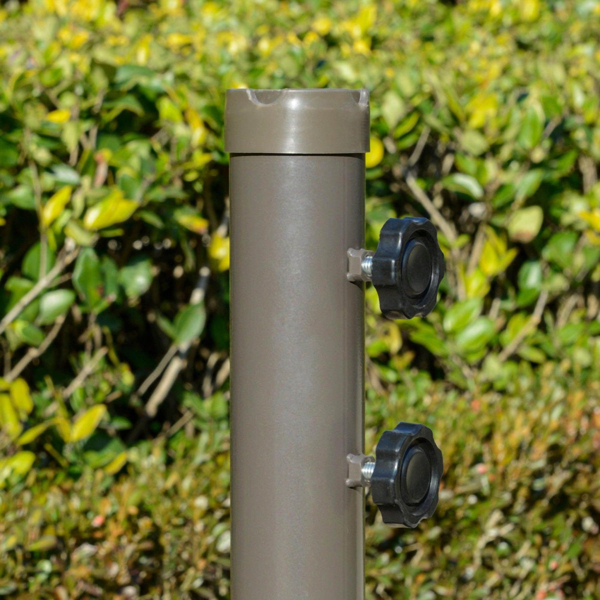 Silver umbrella pole with black adjustment knobs and mounting hardware
