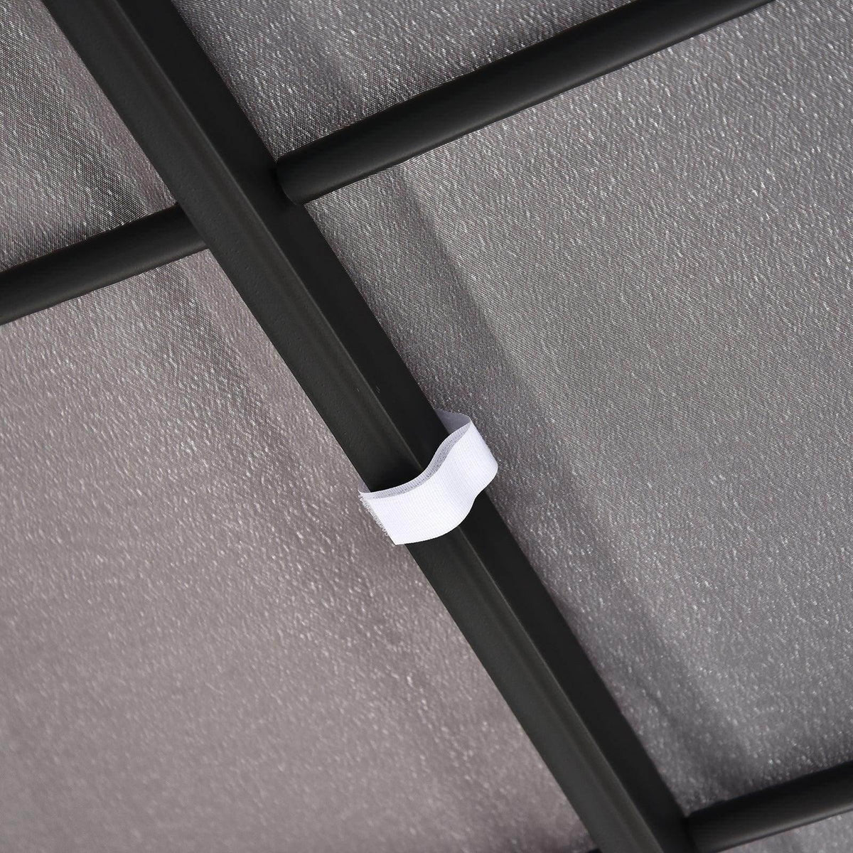 Gazebo awning velcro strap holding dark gray canopy to black support bar