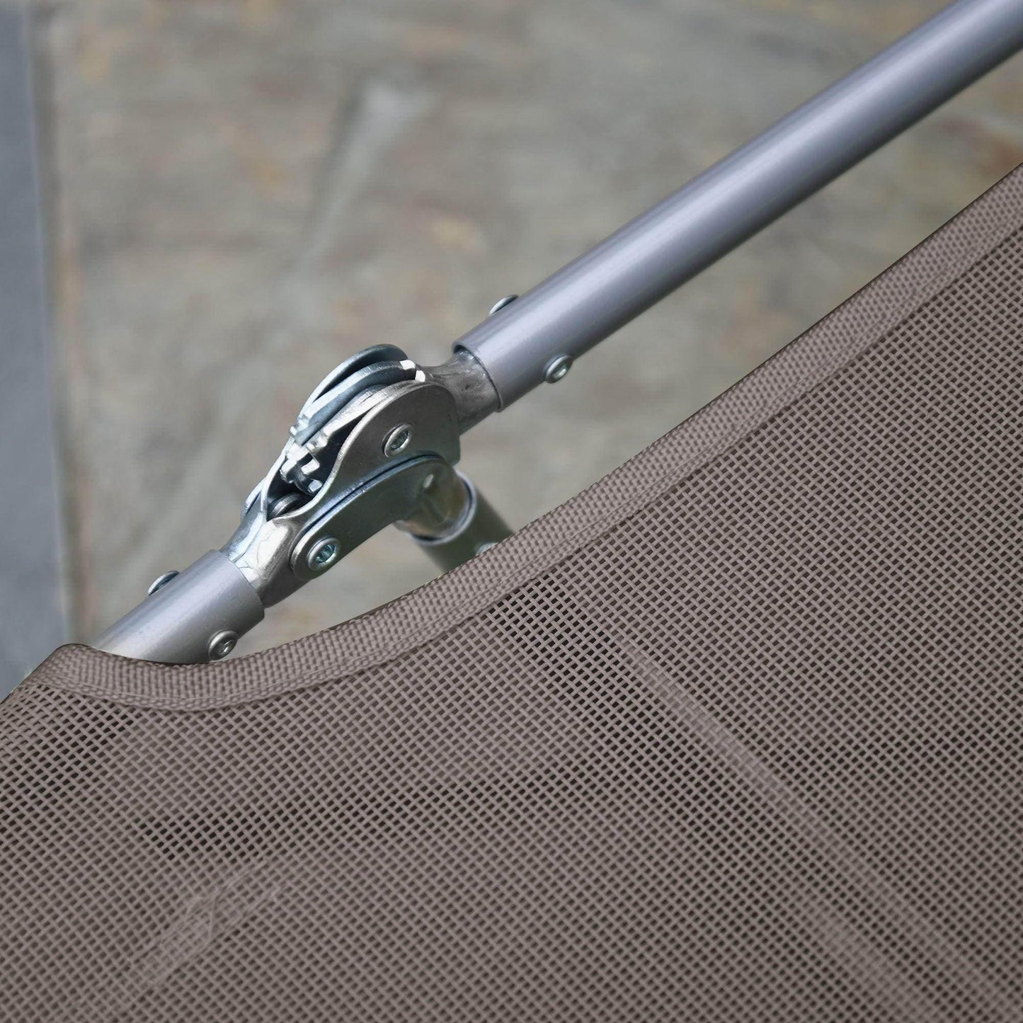 Close-up of adjustable metal joint and brown mesh fabric on Outsunny garden lounge chair