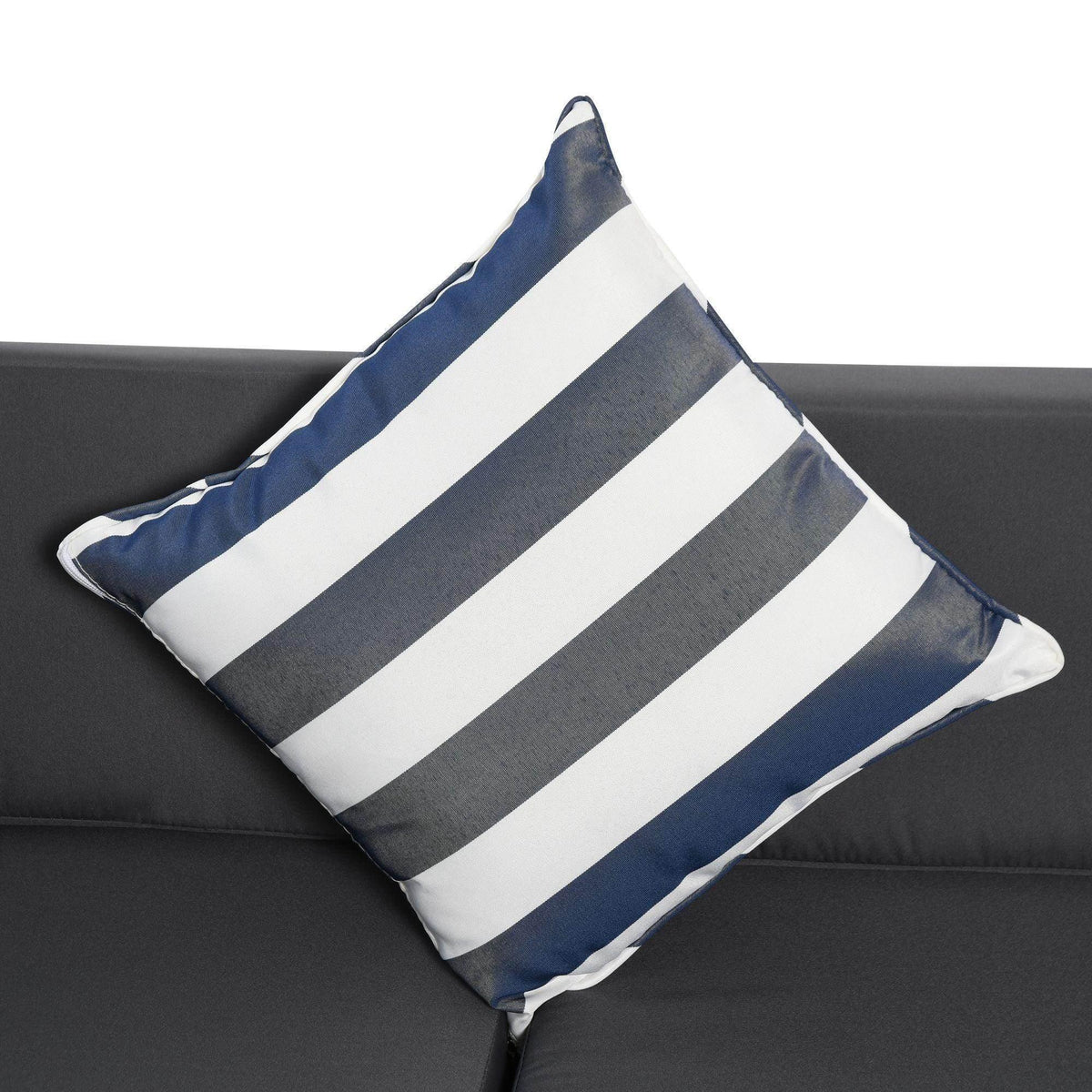 Blue and white striped throw pillows on a dark gray outdoor rattan sofa cushion