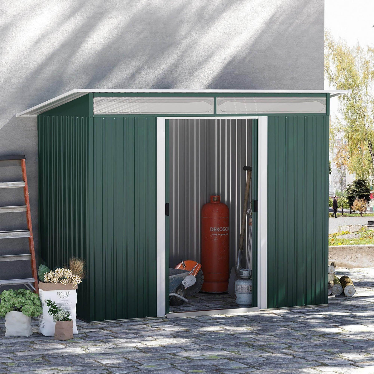 Green metal garden shed with sliding doors and window panel