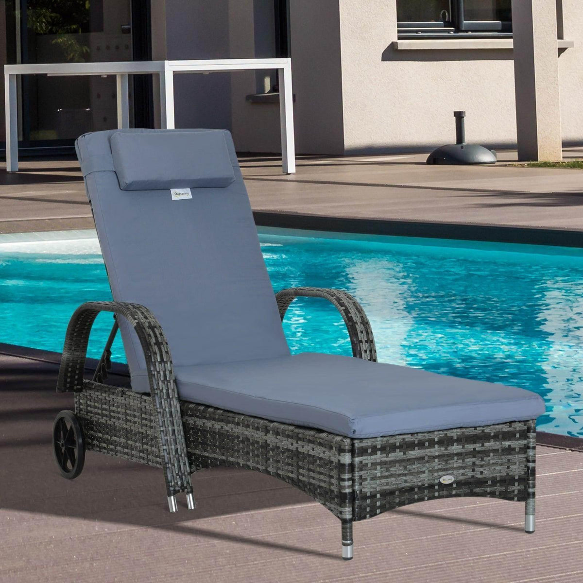 Grey padded recliner sun lounger with woven base and side wheels.