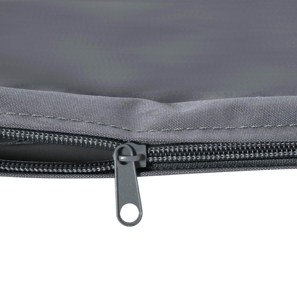 Grey cushion cover zipper with metal pull and stitched fabric edge