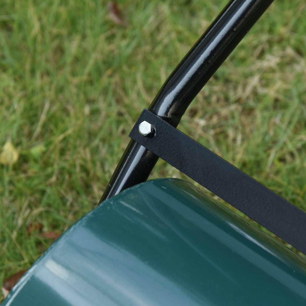 Green lawn roller drum with black handle bracket and metal frame