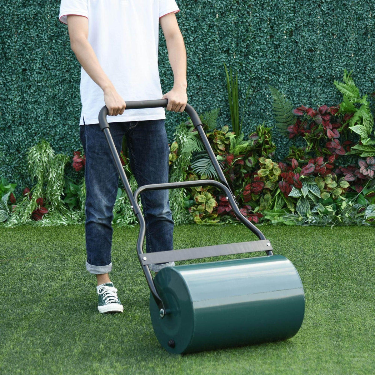 Lawn roller drum scraper with U-bar handle and teal steel drum for garden leveling