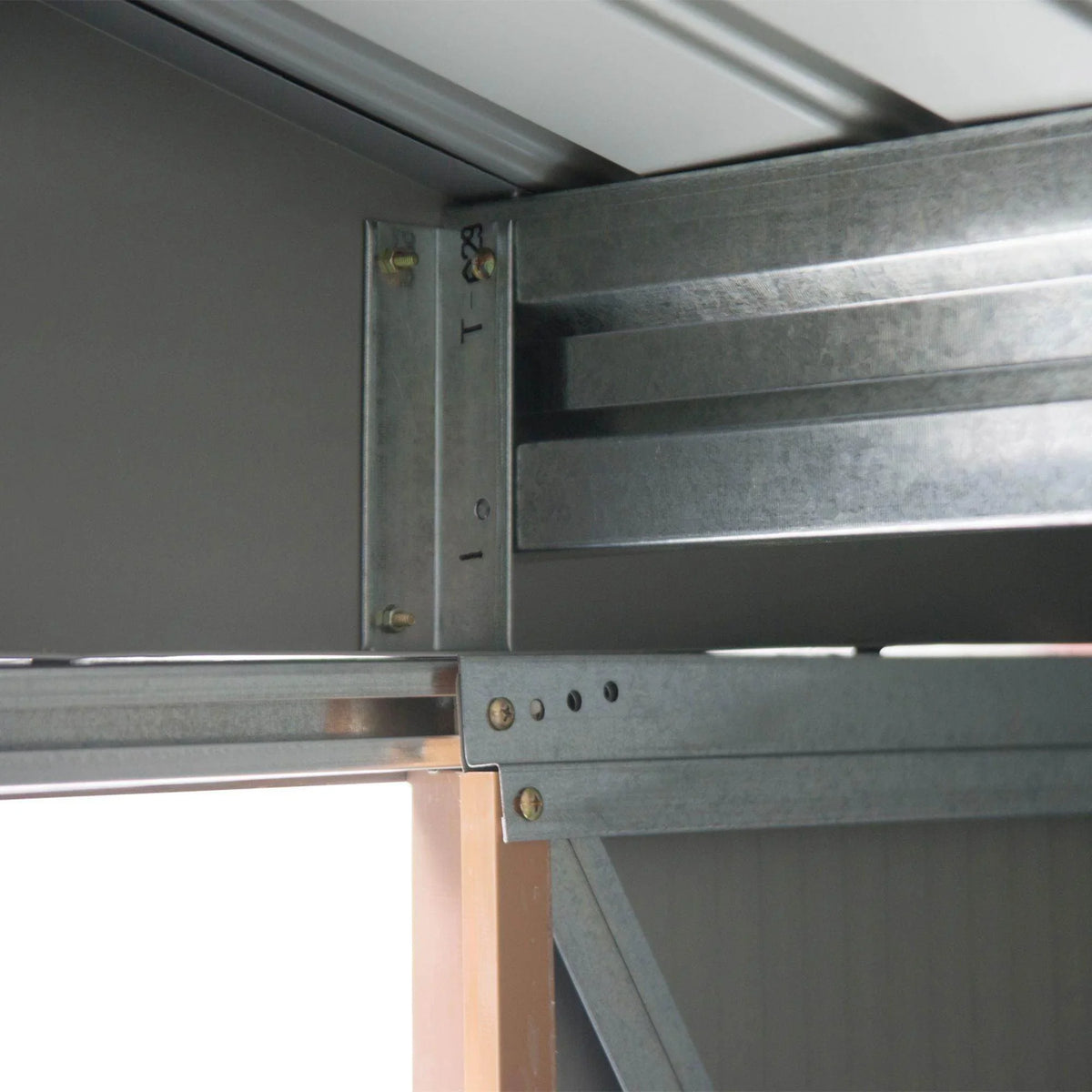 Metal shed frame and door track hinge detail with locking hardware