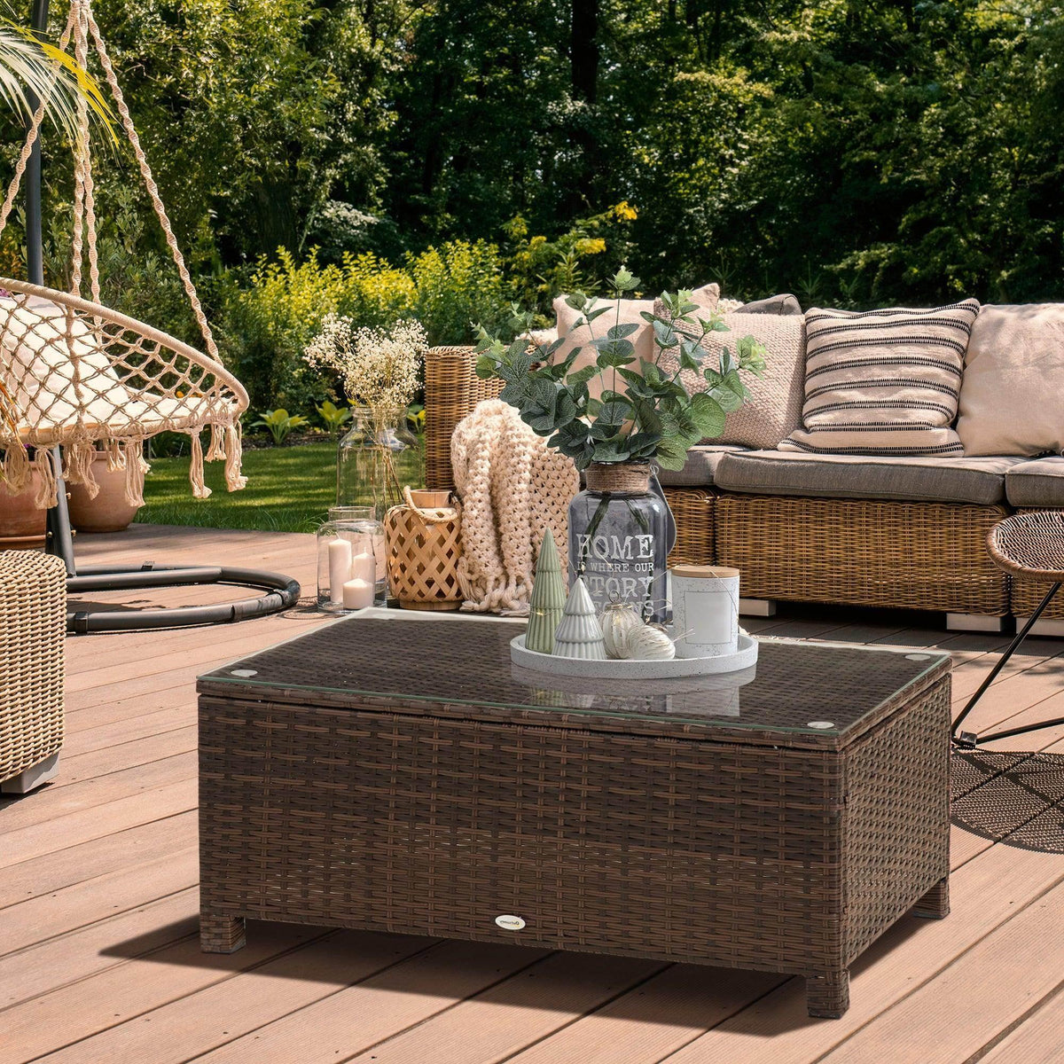 Brown rattan coffee table with clear tempered glass top and storage shelf