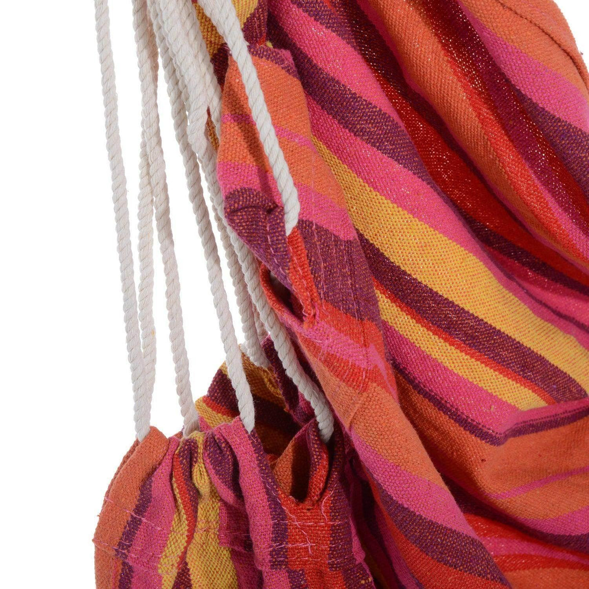 Close-up of multicolor striped hammock fabric with thick cotton rope fringes