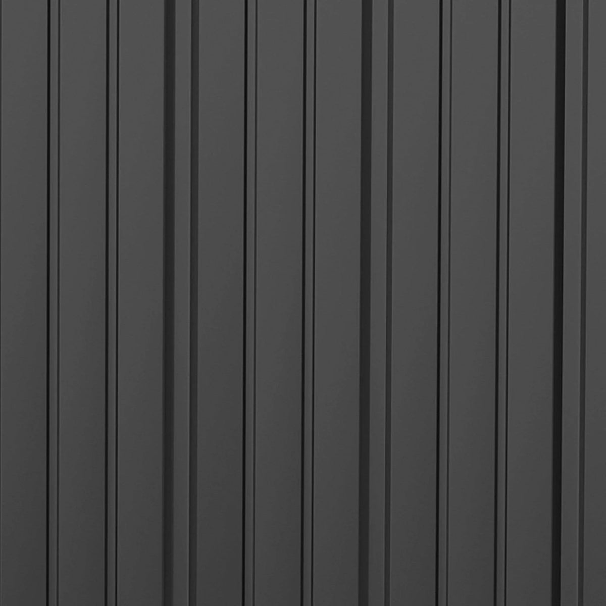 Dark gray metal shed wall panels with vertical ridges, close-up