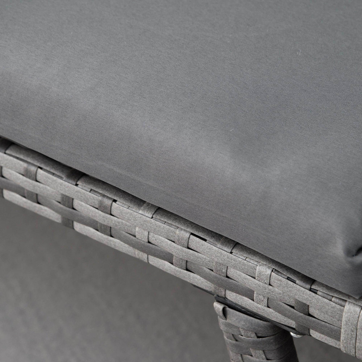 Outsunny grey sofa bed armrest detail with woven rattan texture and upholstered cushion
