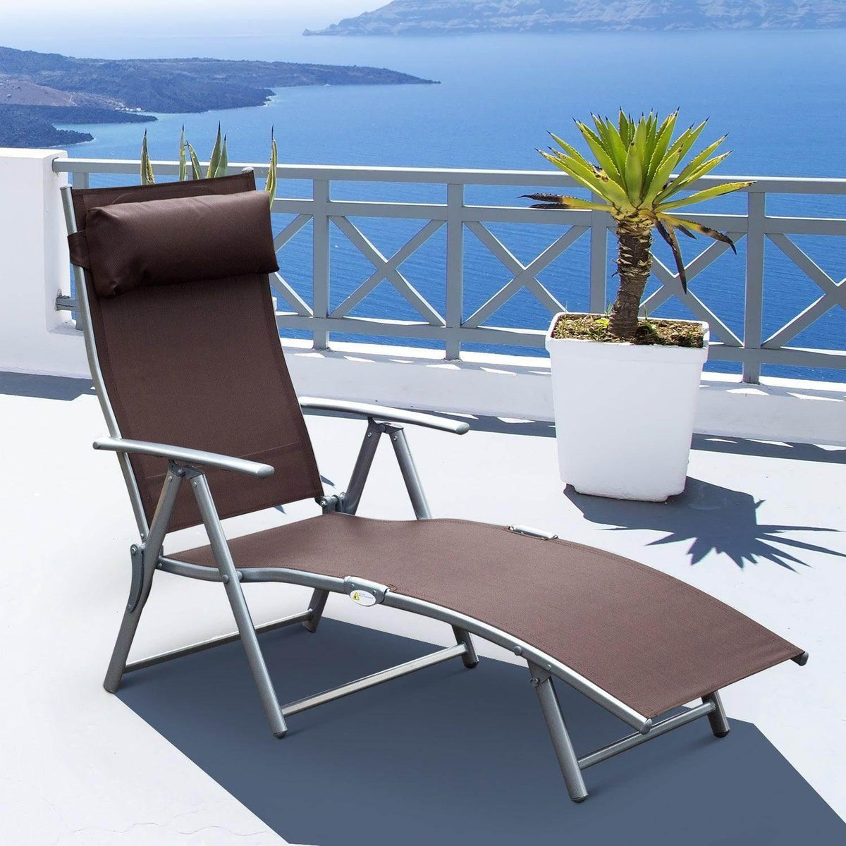 Outdoor reclining lounger chair with dark brown padded headrest and lounge seat