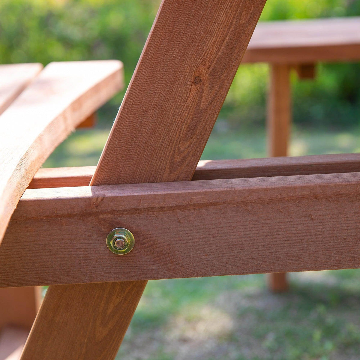Wooden bench support joint with metal screw and slatted tabletop