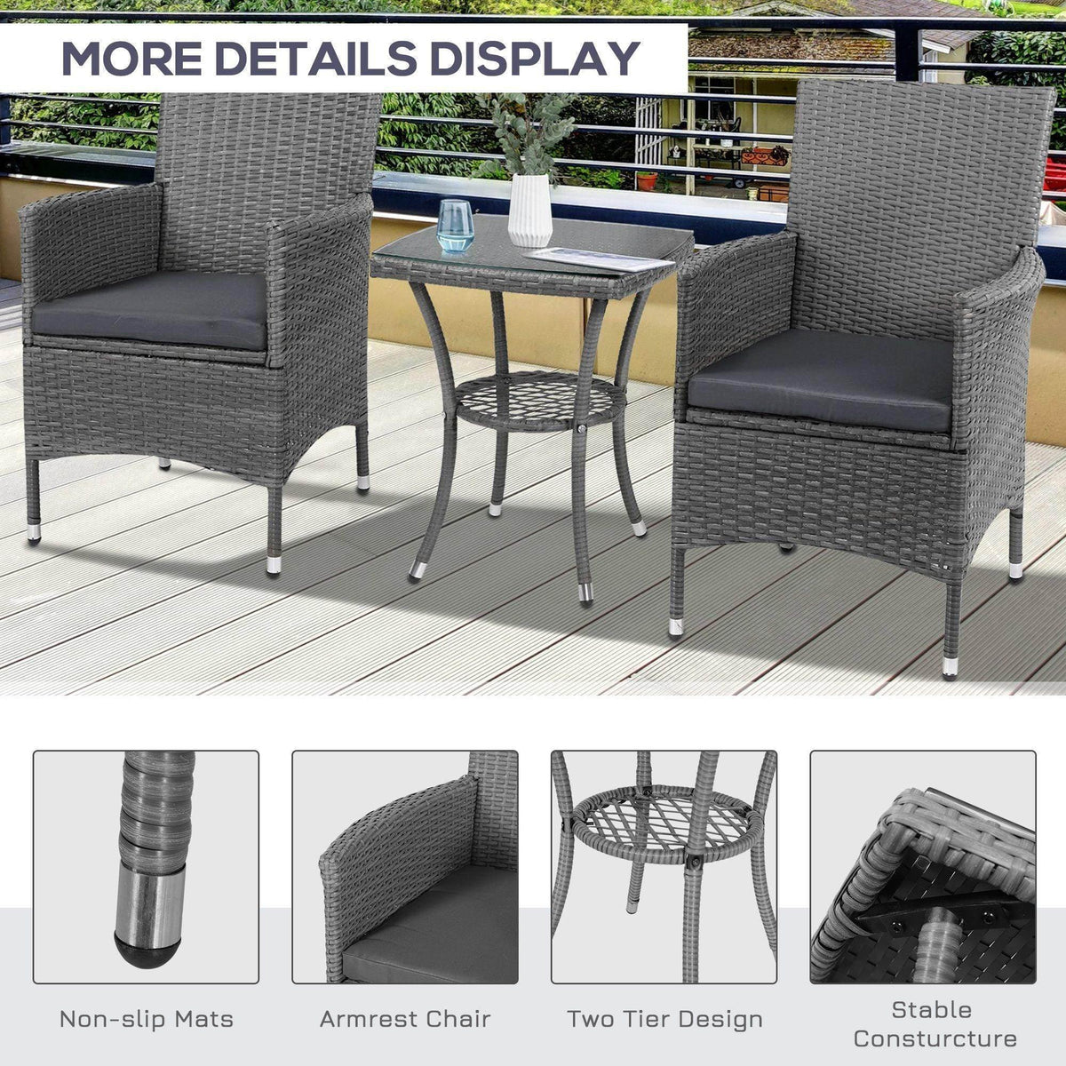 Gray rattan patio bistro set with two armchairs, gray cushions, and a glass-top side table