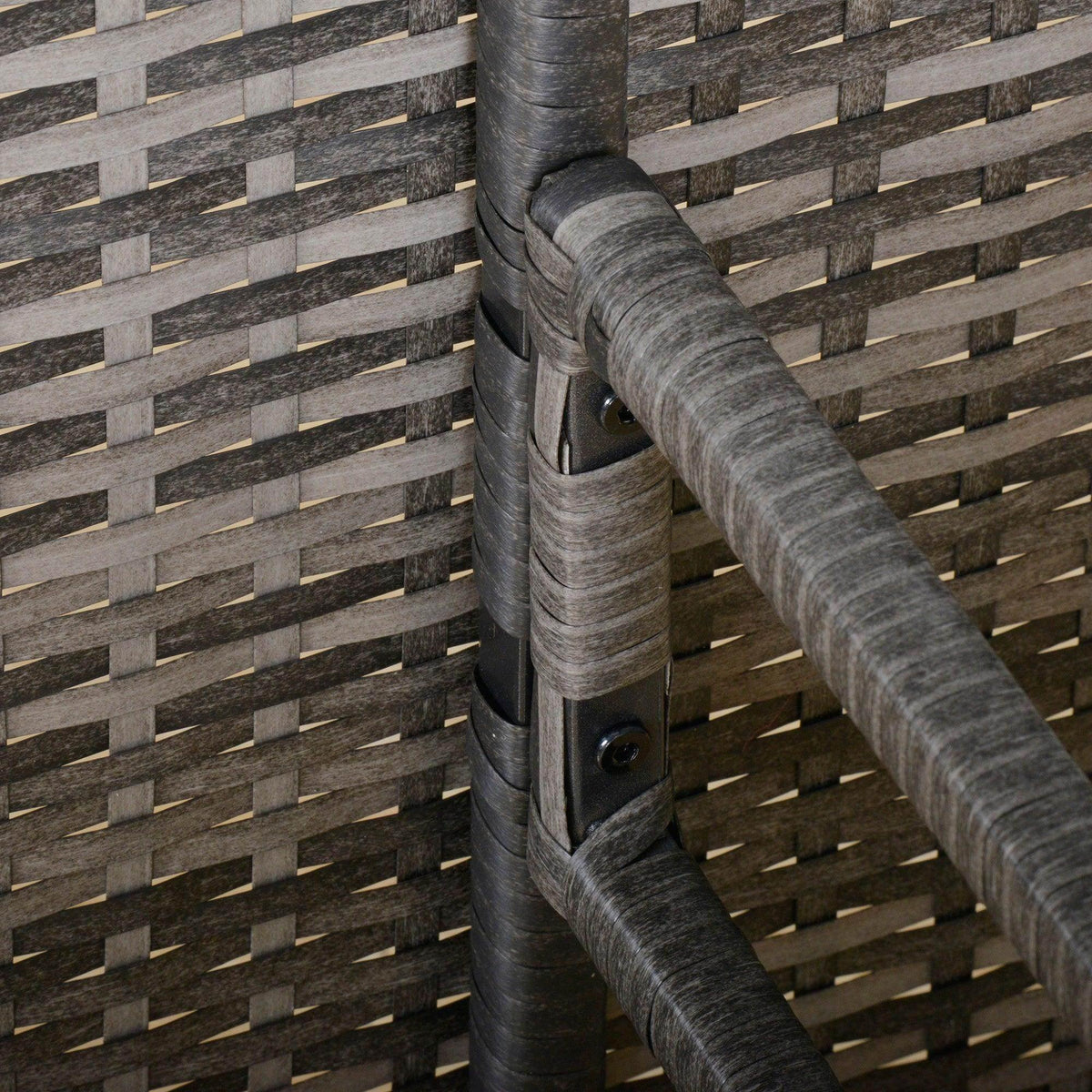 Grey rattan armrest detail with woven texture on corner dining set