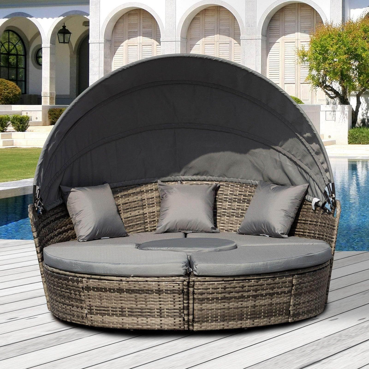 Grey rattan patio daybed sofa with black retractable canopy and grey seat cushions
