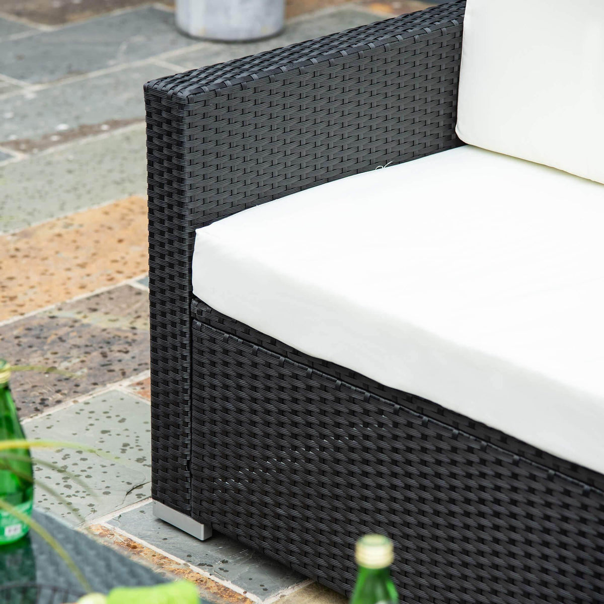 Rattan single seat with dark woven armrest and white cushion, outdoor patio sofa