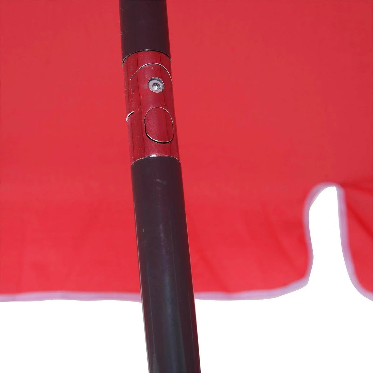 Red parasol pole with base latch detail and bolt/connector at top