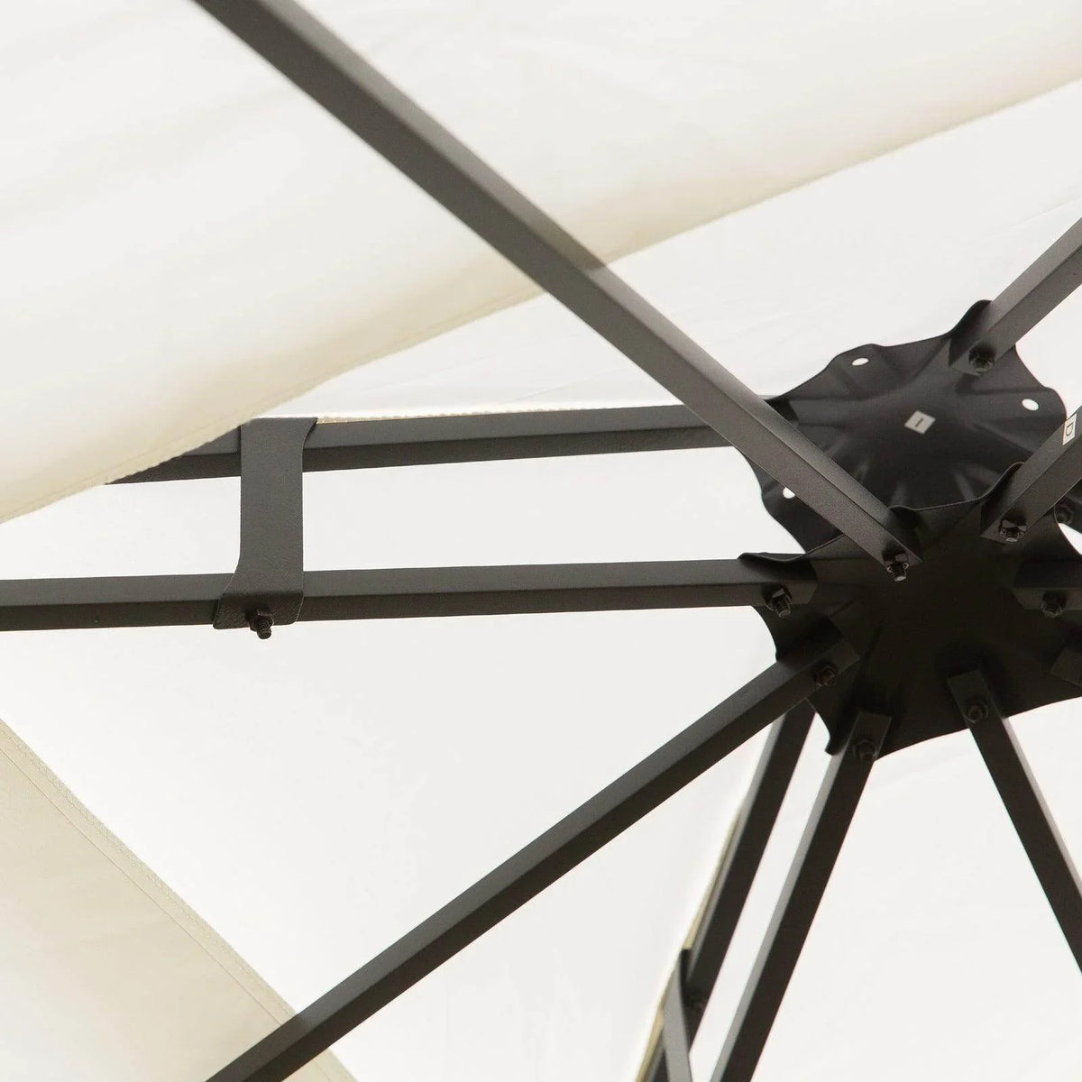 Cream gazebo roof fabric with black steel support legs and cross-brace connection