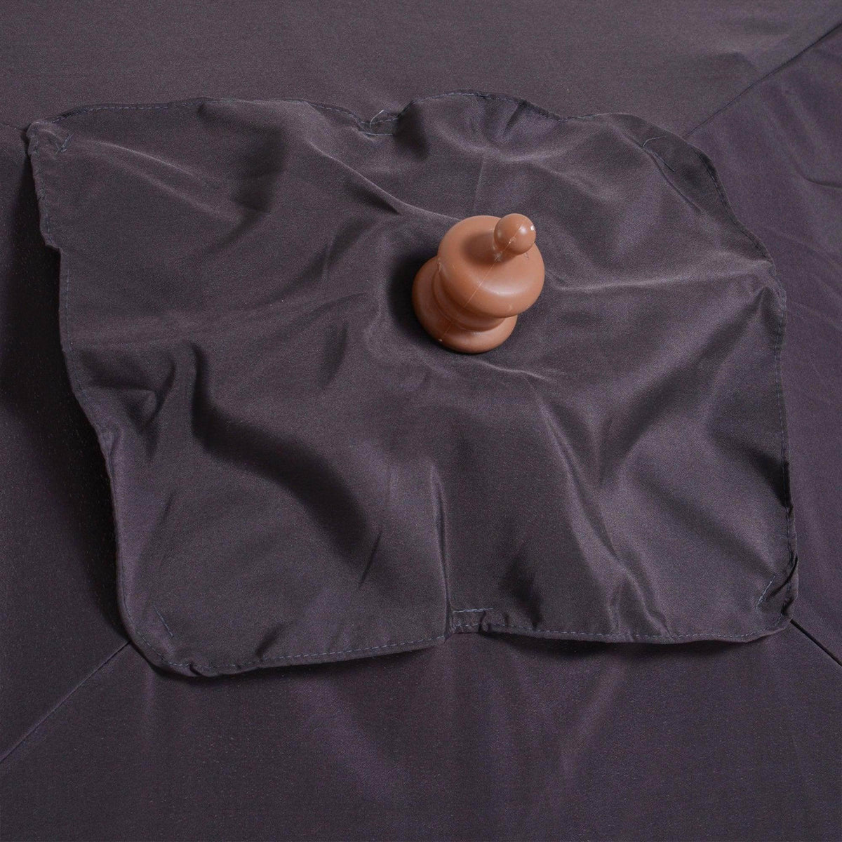 Deep grey parasol canopy with round fabric knob on top