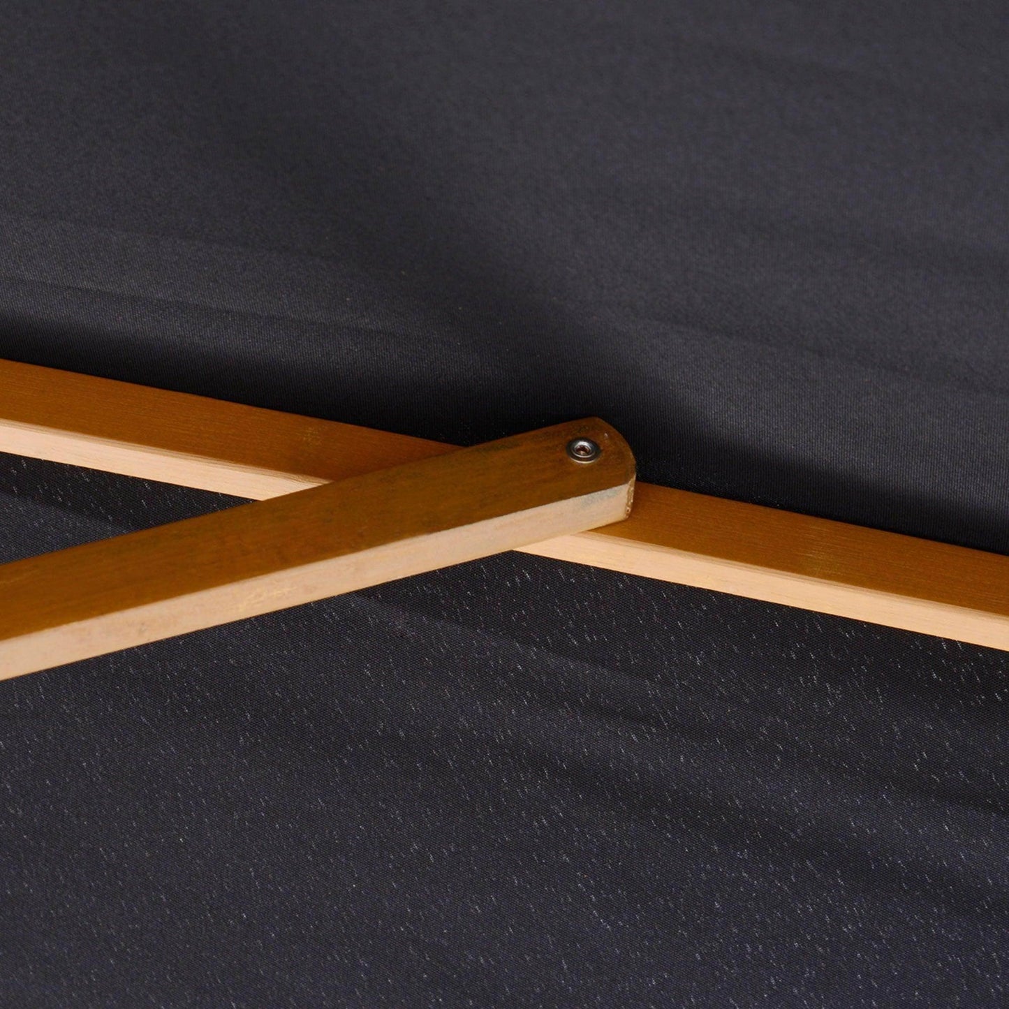 Close-up of wooden frame cross joint on black fabric patio parasol from All4U Retailer LTD