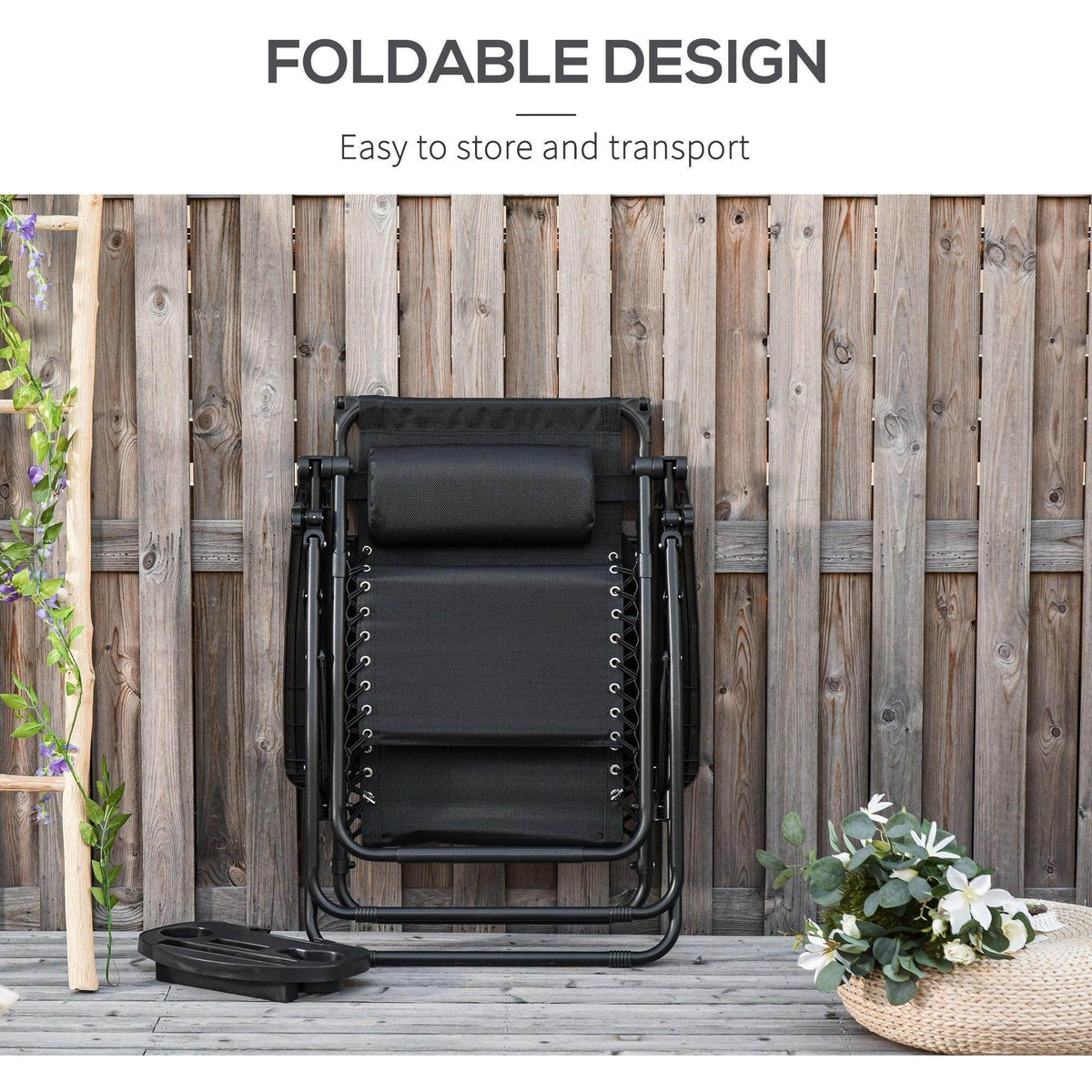 Folded black zero gravity patio lounger with canopy, stacked for storage